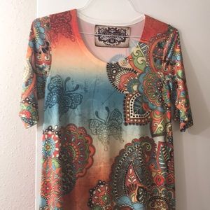 Long Amma top with asymmetrical hem.